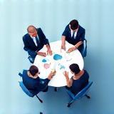 Professionals discussing strategy around a table.